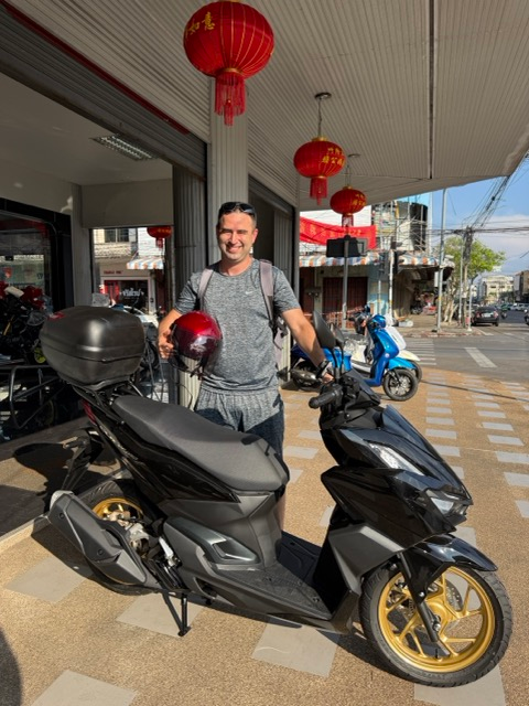 Eric Claggett purchases a motorbike in Udon Thani, Thailand.