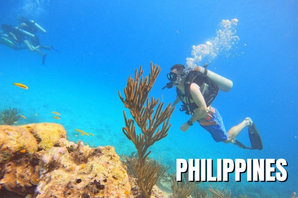 American expat scuba dives in Dauin, Dumaguete, Philippines