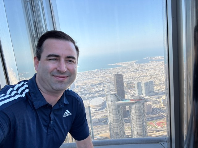 Author with a bloated face at the Burj Khalifa, one week after gaining weight in the United States.