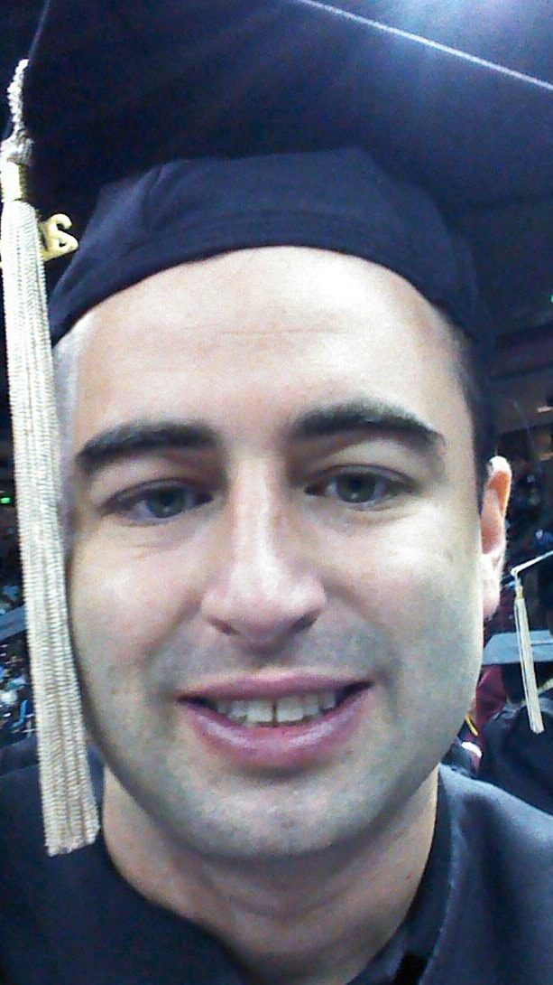 Eric graduating college.