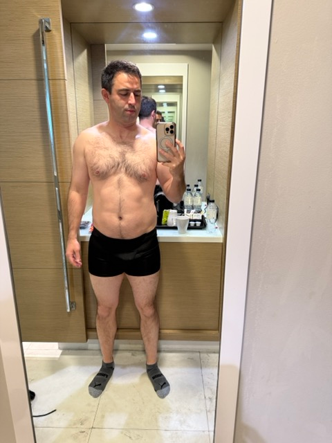 Author mirror selfie after gaining weight in United States.