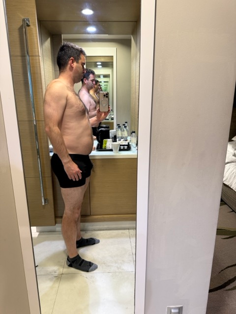 Author mirror selfie after gaining weight in United States.