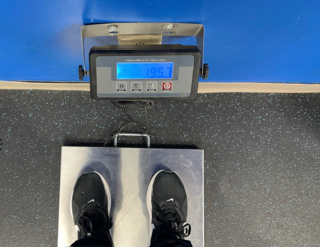 Author weighing himself at 195.7 pounds, the most overweight he's ever been.
